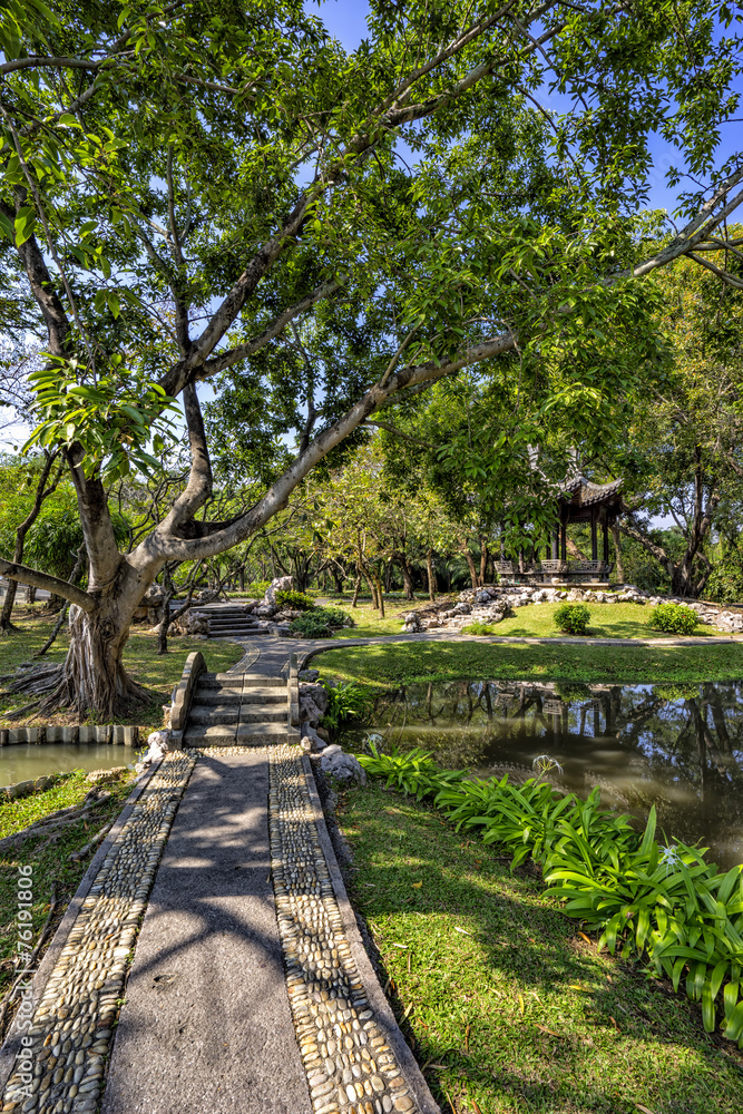 Chinese classical garden with pavilions and pond Chinese classical garden with pavilions and pond