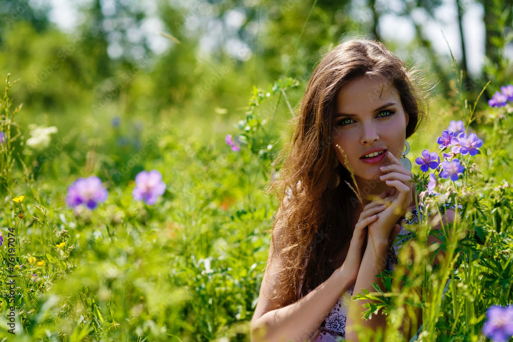 young sexy girl with flowers in the field young sexy girl with flowers in the field
