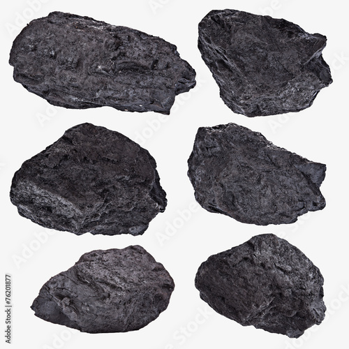 Coal lumps spilled on white