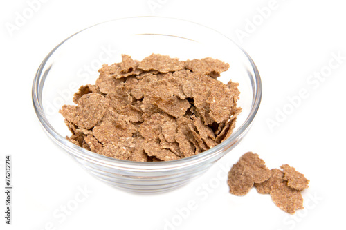 Cereals in glass bowl on white background