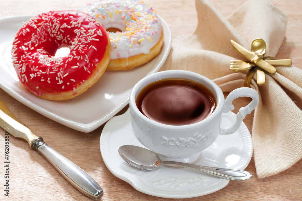 Hot tea with delicious doughnut Hot tea with delicious doughnut