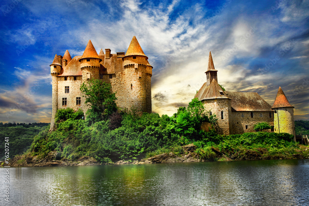fairy castle on lake over sunset - chateau de Val, France