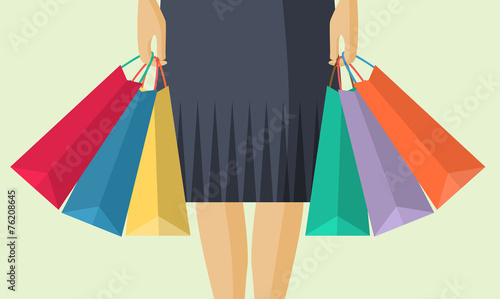 The lower part of the woman with packages after shopping