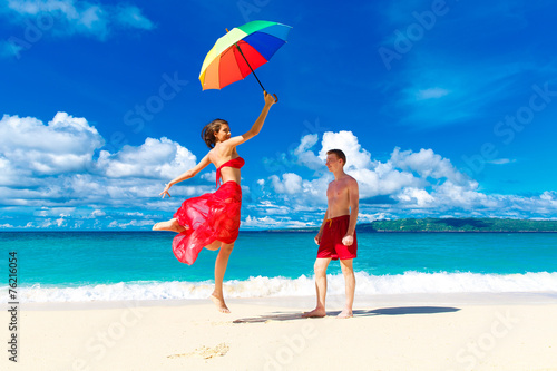 young happy loving couple having fun in the tropical beach with © frolova_elena