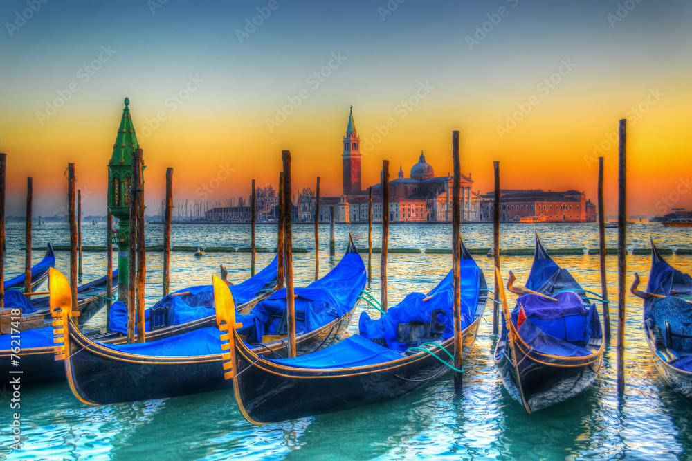 blue gondolas under a colorful sunset blue gondolas under a colorful sunset