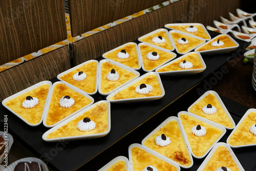 Catering - served table with crème brulee desserts