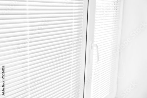 White window with opened blinds