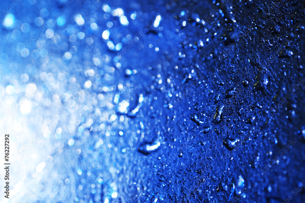 Water drops on color surface background, macro view Water drops on color surface background, macro view