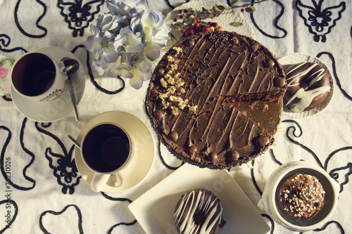 Chocolate cakes and Coffee table with teacups