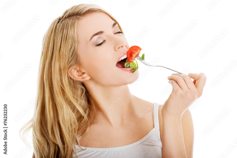 Smiling woman eating salat Smiling woman eating salat