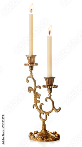 Retro candlestick with candles, isolated on white © Africa Studio