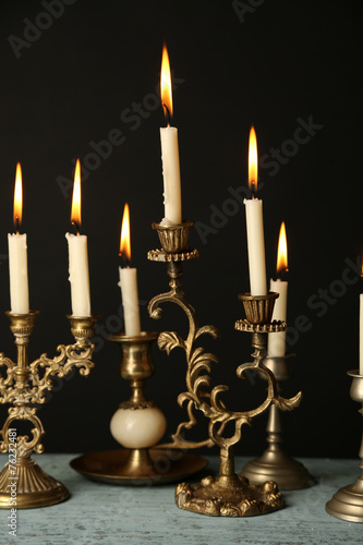 Retro candlesticks with candles © Africa Studio