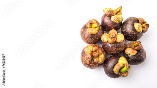 Ripe mangosteen fruit over white background