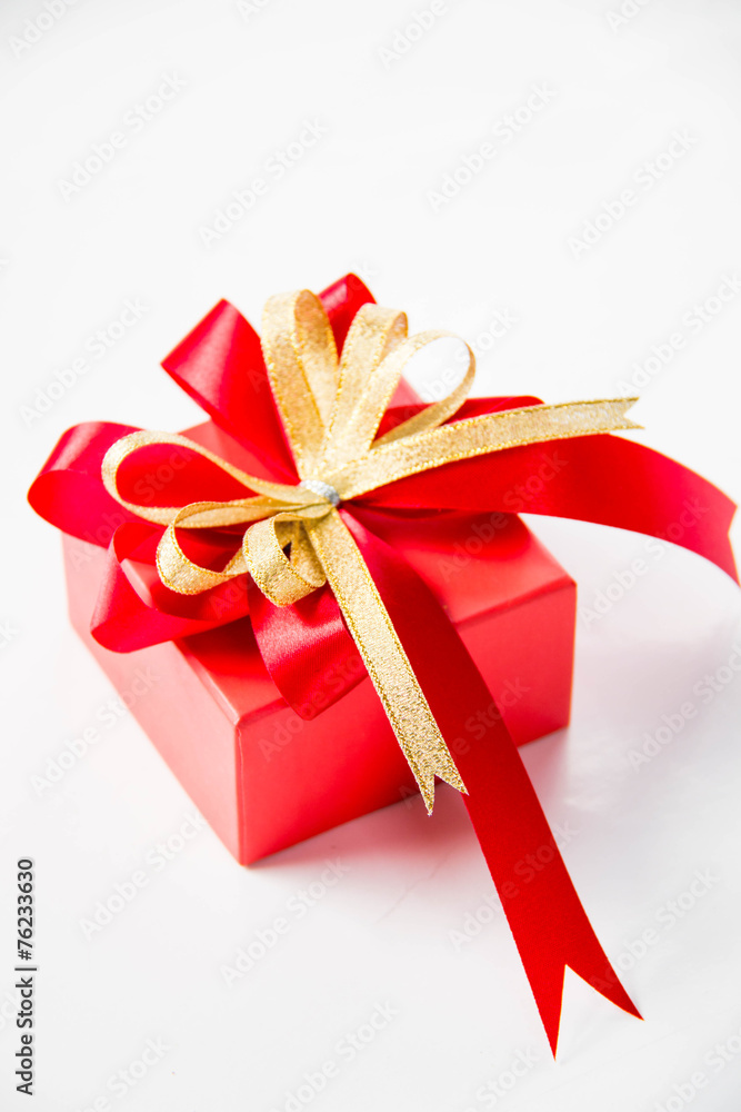 Gold gift box with ribbon and bow Gold gift box with ribbon and bow