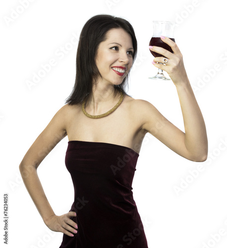 Beautiful woman looking through glass of wine