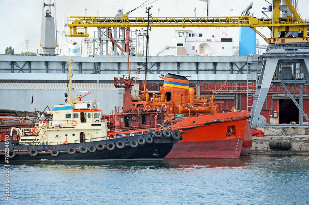Bunker ship and tugboat under port crane, Odessa, Ukraine Bunker ship and tugboat under port crane, Odessa, Ukraine