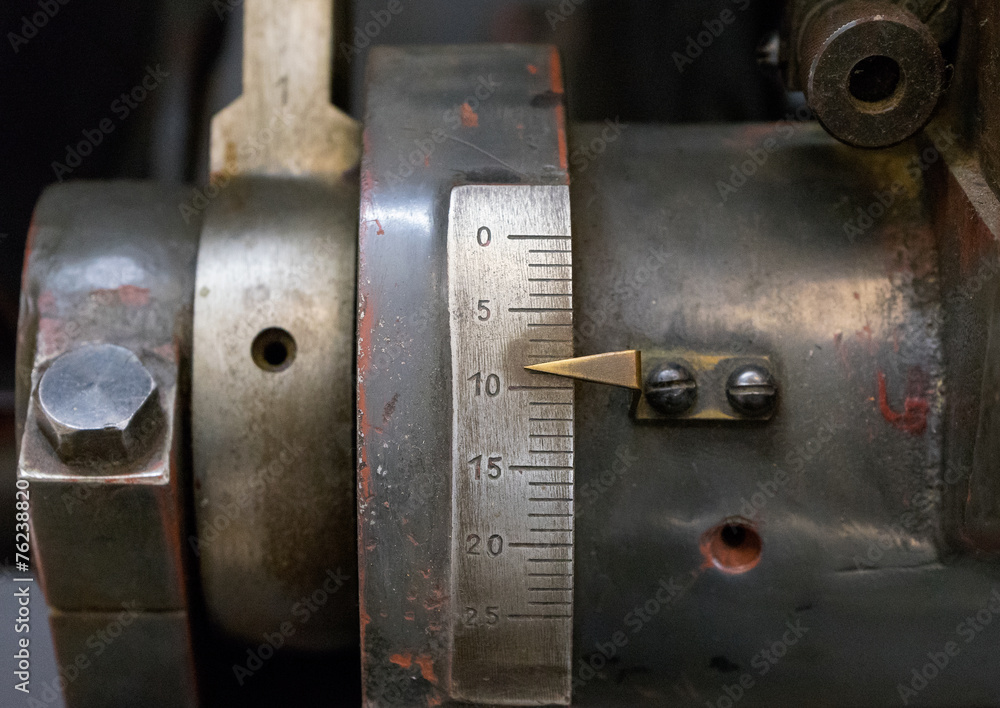 Scale with a pointer on old machine in printing house Scale with a pointer on old machine in printing house