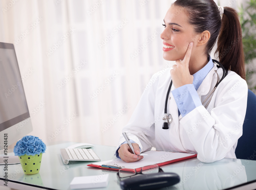 young female doctor working in office young female doctor working in office
