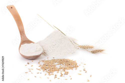 Flour wheat ear and wood spoon.