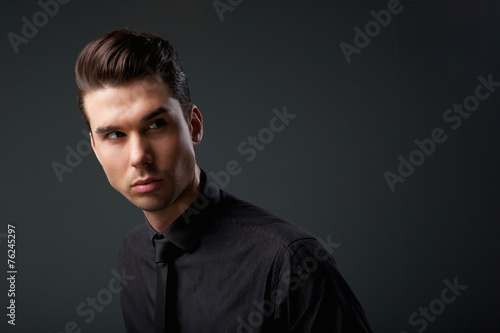 Handsome young man with modern hairstyle