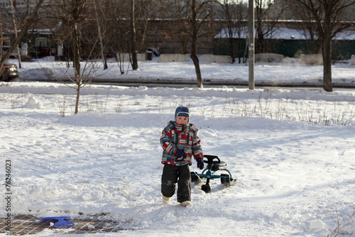 Child with a snow racer