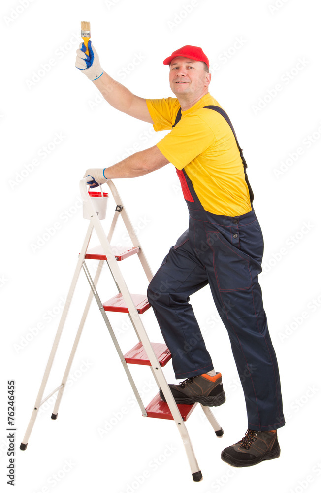 Worker on ladder with brush. Worker on ladder with brush.