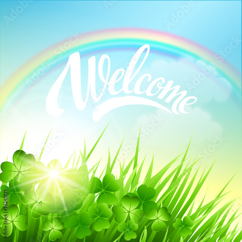 Spring landscape with clover and rainbow