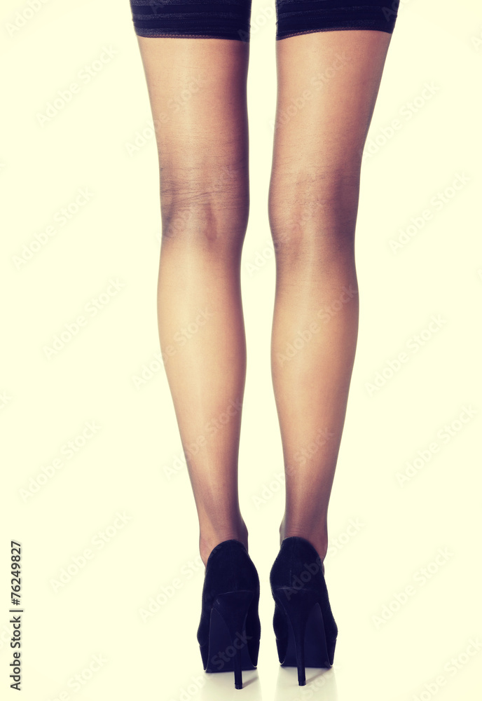 Beautiful long woman's legs in black high heels. Beautiful long woman's legs in black high heels.