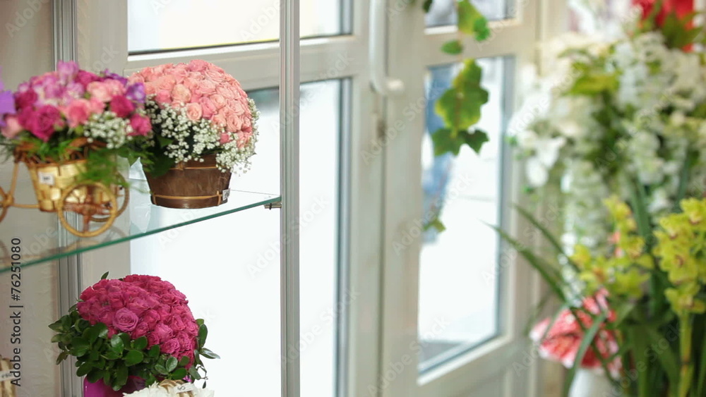Flower shop interior with floral arrangements and bouquets Flower shop interior with floral arrangements and bouquets
