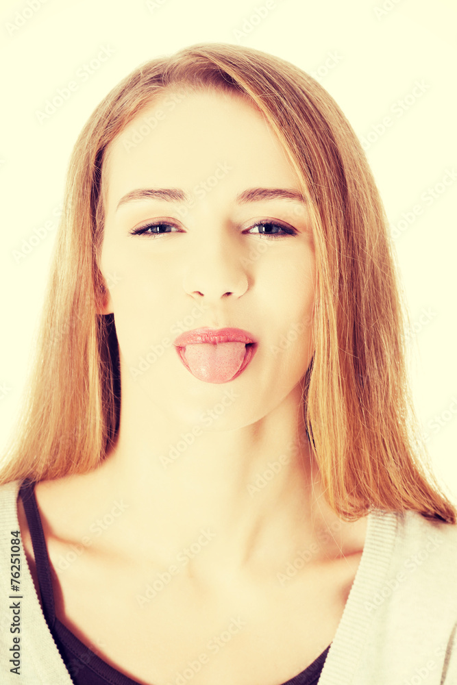 Beautiful blond woman showing her tongue. Beautiful blond woman showing her tongue.