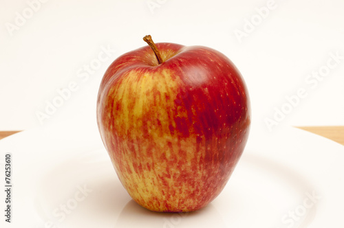Apple on a white plate