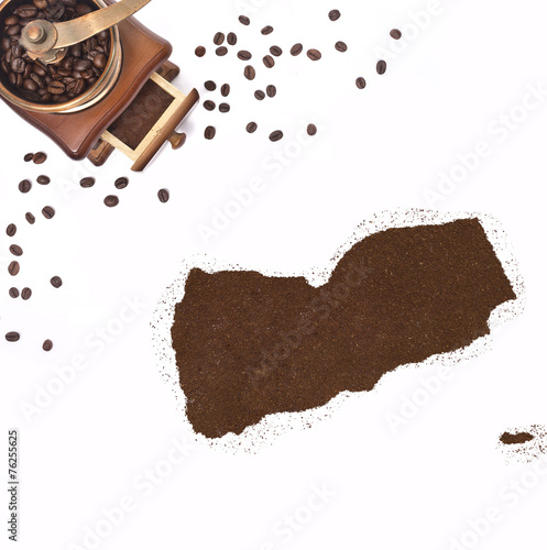 Coffee powder in the shape of Yemen and a coffee mill.(series) photo