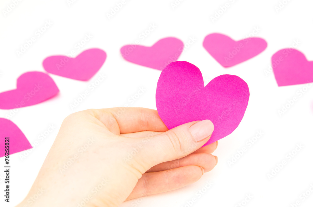 female hand holding a valentine female hand holding a valentine