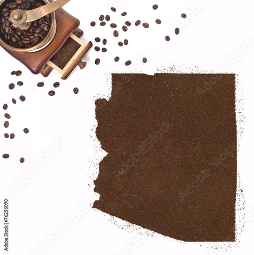 Coffee powder in the shape of Arizona and a coffee mill.(series) photo