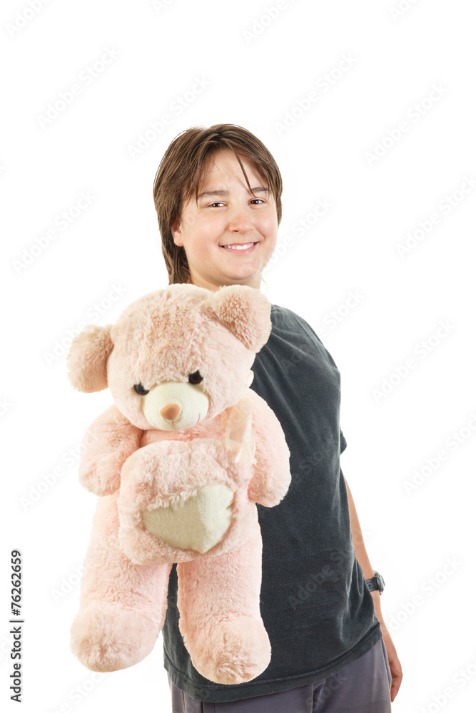 boy smiling and holding teddy bear toy as gift for girl boy smiling and holding teddy bear toy as gift for girl