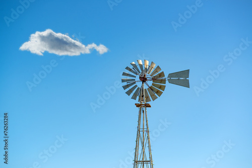 Old Style Windmill Against a Blue Sky