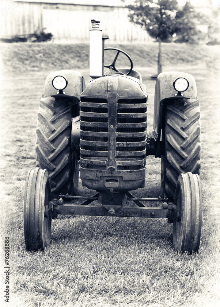 Fototapeta premium An Old Farm Tractor - Lightly Toned