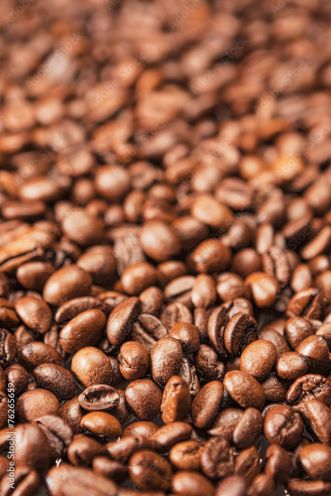 Closeup Background Made of Heap of Roasted Coffee Beans. Closeup Background Made of Heap of Roasted Coffee Beans.