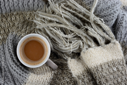 hot chocolate with knitted scarf in the winter