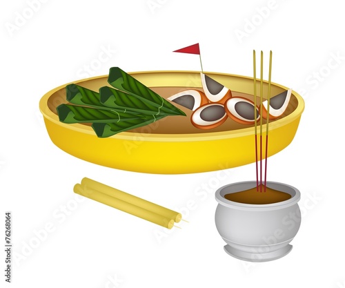 Areca Nuts and Betel Leaves with Candle and Joss Stick