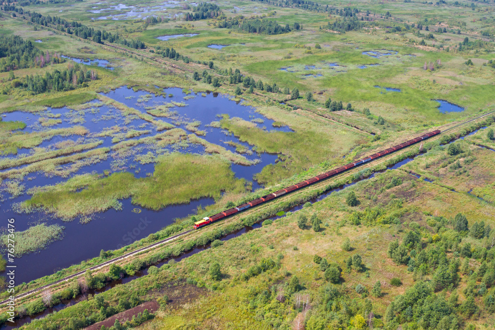 Aerial view of bog landscape and train with turf