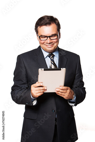 Portrait of a mature business man using tablet. Isolated on