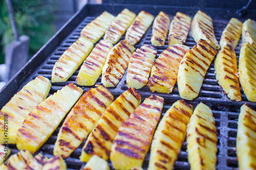 Fried pineapples on grill outdoor