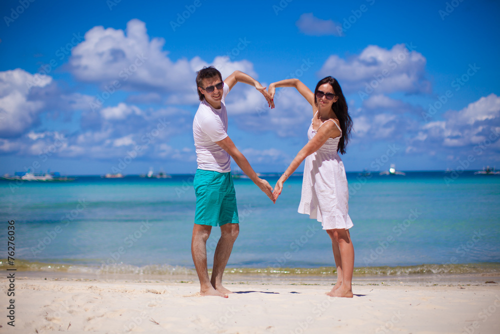 Romantic couple enjoy vacation on tropical white beach