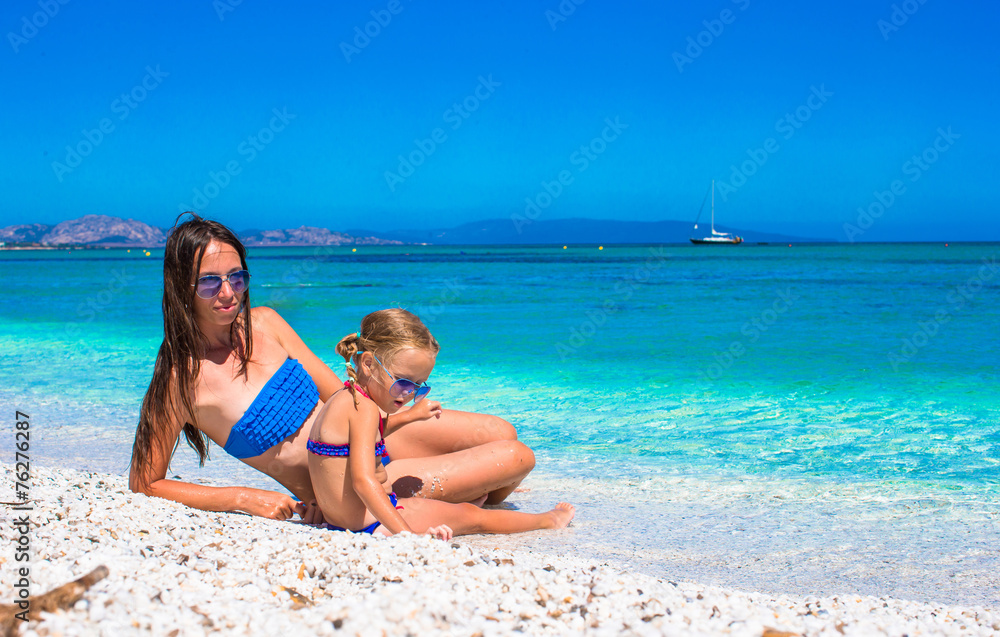Little girl and happy mom during summer vacation Little girl and happy mom during summer vacation
