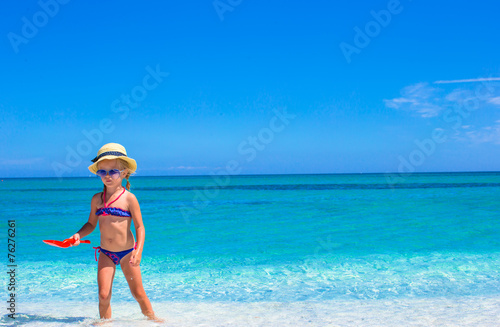 Adorable little girl having fun during beach vacation © travnikovstudio