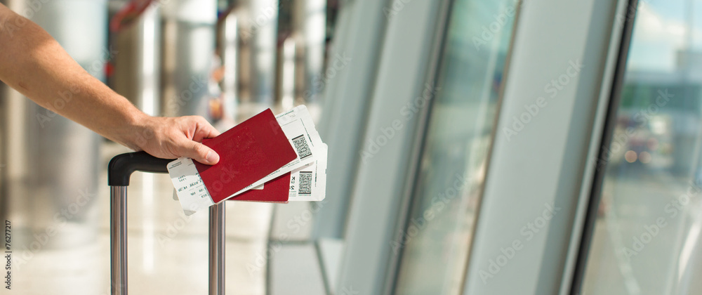 Closeup passports and boarding pass at airport indoor