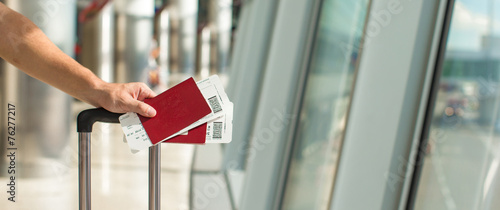 Closeup passports and boarding pass at airport indoor