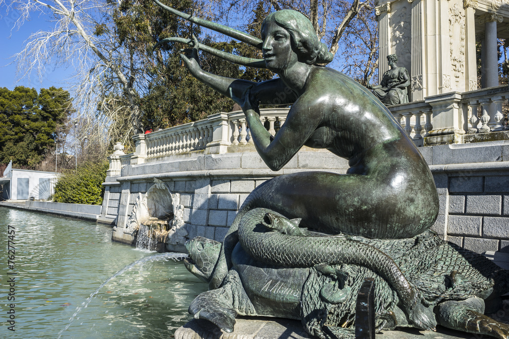 bronze sculpture of a mermaid. Lake in Retiro park, Madrid Spain