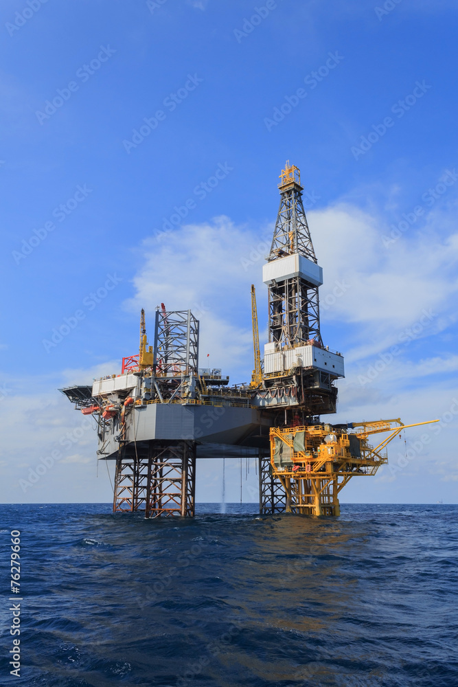 Offshore Jack Up Drilling Rig Over The Production Platform in Th